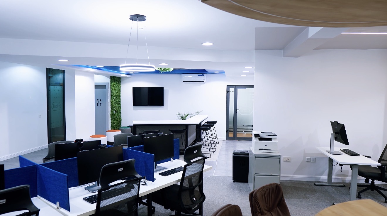 Roche Abuja open office with blue-partitioned workstations